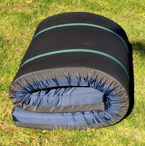 Blue nylon camping mattress rolled up