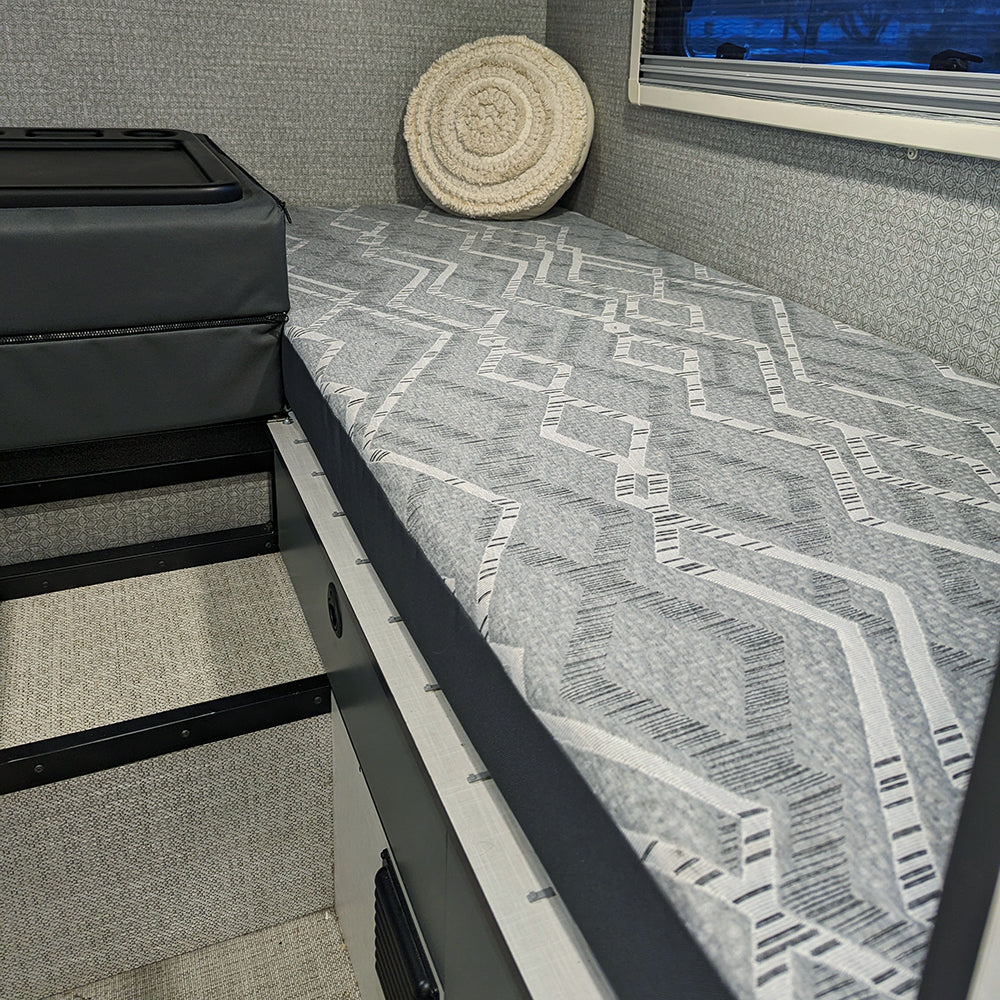 Lifestyle view of the EKKO replacement mattress driver side and the center folded up