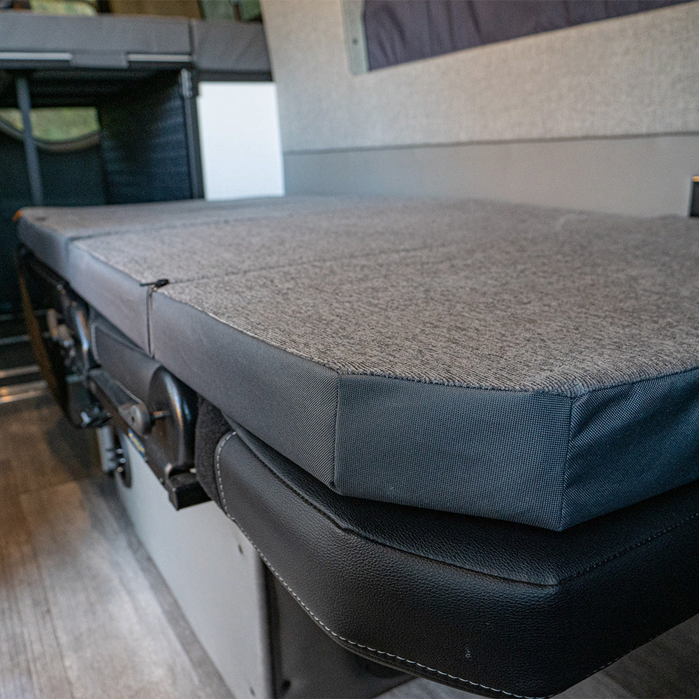 Detail view of RoamRest mattress topper fitting on top of original Storyteller GrooveLounge