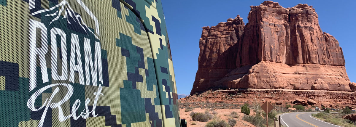 RoamRest camo van in the desert