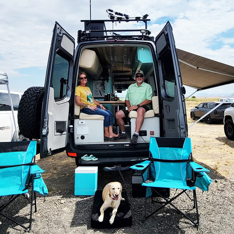 Smiling inside van with RuffRoost dog bed