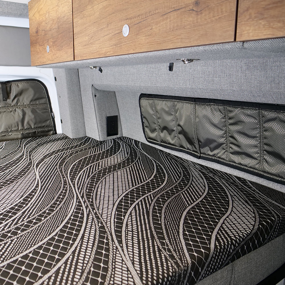 Storyteller mattress topper installed on van bed